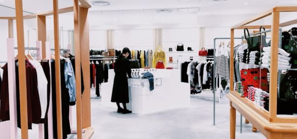 Woman standing inside a clothing area